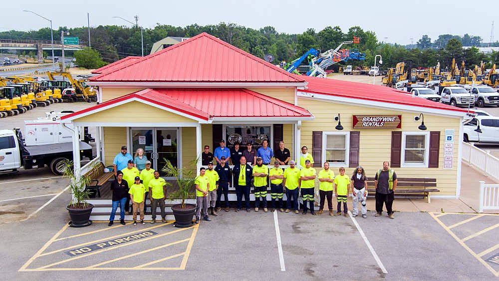 The Brandywine Rentals team in front of their office and equipment yard