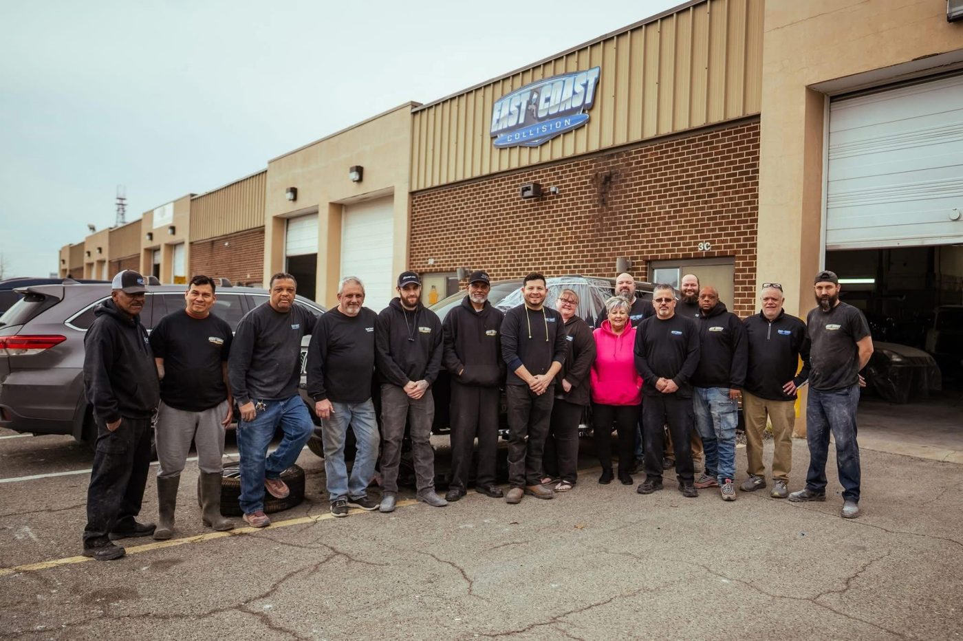 East Coast Collision Center team outside the shop