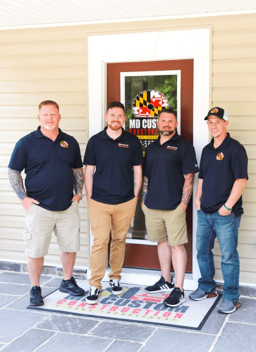 The MD Custom Construction team at their office